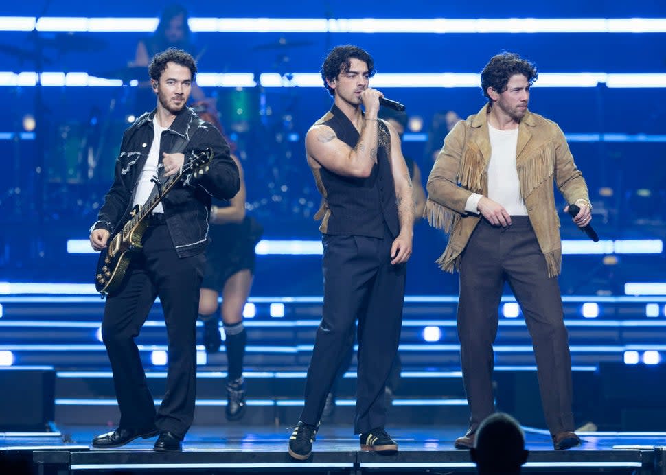  Kevin Jonas, Joe Jonas and Nick Jonas of Jonas Brothers perform on stage during their 'Five Albums. One Night. The World Tour' at Rogers Arena on November 11, 2023 in Vancouver, British Columbia, Canada.