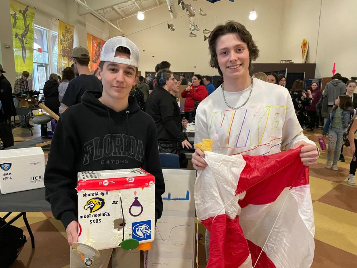 Nick Hallihan and Kolton Collins, students at Blackville School, built a high-altitude research balloon to capture images, video and data of the rare total solar eclipse. (Alexandre Silberman/CBC - image credit)