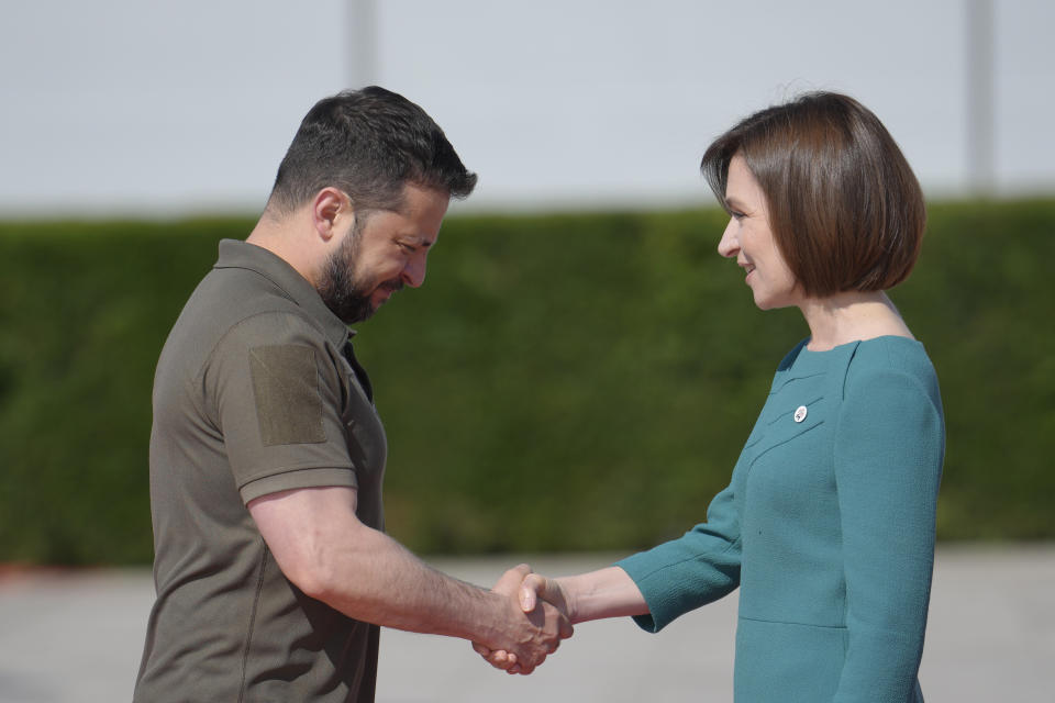 Moldova's President Maia Sandu, right, greets Ukraine's President Volodymyr Zelenskyy during arrivals for the European Political Community Summit at the Mimi Castle in Bulboaca, Moldova, Thursday, June 1, 2023. Leaders are meeting in Moldova Thursday for a summit aiming to show a united front in the face of Russia's war in Ukraine and underscore support for the Eastern European country's ambitions to draw closer to the West and keep Moscow at bay. (AP Photo/Vadim Ghirda)