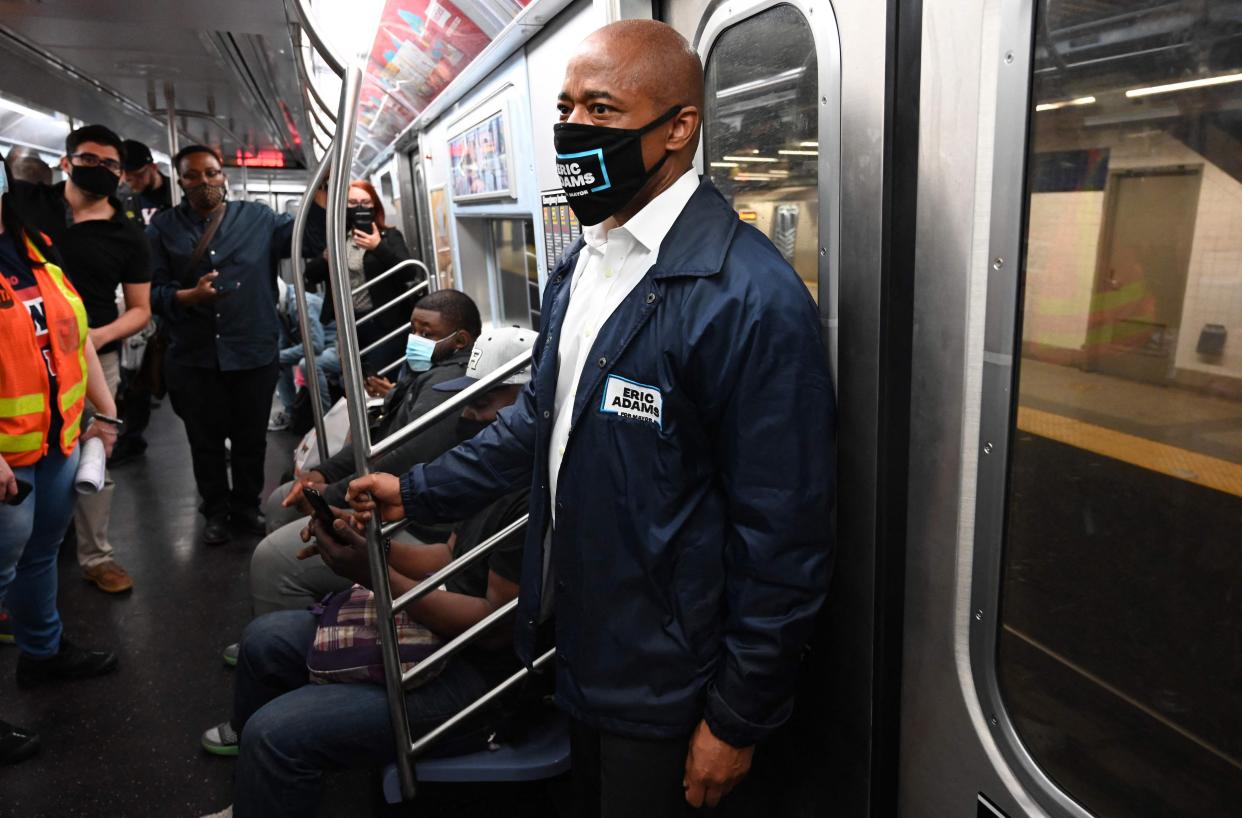 New York City Mayor Eric Adams riding the subway.