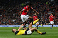 Soccer Football - Carabao Cup Third Round - Manchester United vs Burton Albion - Old Trafford, Manchester, Britain - September 20, 2017 Manchester United's Marcus Rashford in action with Burton Albion's Ben Turner REUTERS/Andrew Yates