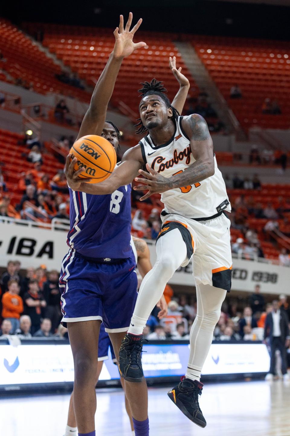 Jan 23, 2024; Stillwater, Oklahoma, USA; Oklahoma State Cowboys guard John-Michael Wright (51) puts up a shot around TCU Horned Frogs center Ernest Udeh Jr. (8) during the first half at Gallagher-Iba Arena. Mandatory Credit: William Purnell-USA TODAY Sports