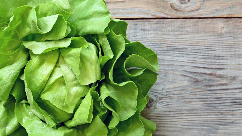 Green salad on wooden background