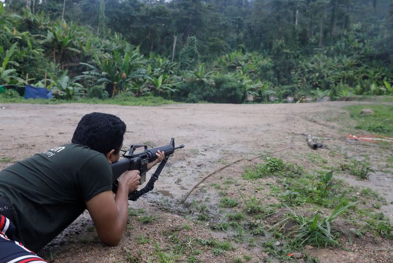 The Wider Image: In Myanmar jungle, civilians prepare to battle military rulers