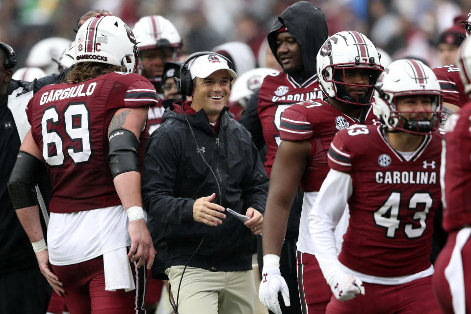 South Carolina head coach Shane Beamer smiles after his team scored a touchdown during the first half of an NCAA college football game against Vanderbilt, Saturday, Nov. 11, 2023, in Columbia, S.C. (AP Photo/Artie Walker Jr.)