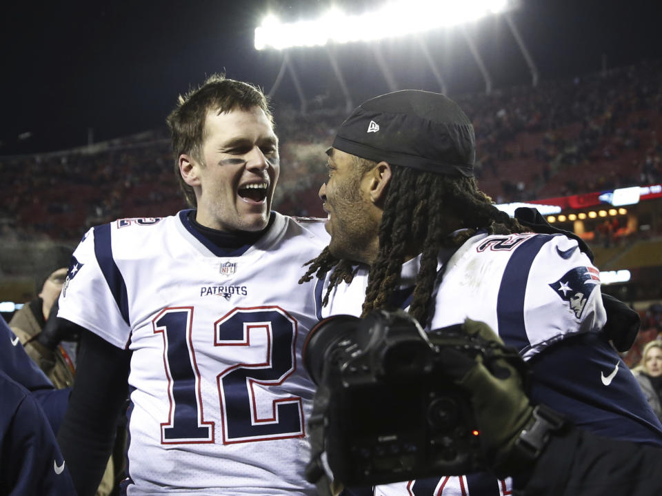 New England Patriots quarterback Tom Brady (12) celebrates with cornerback Stephon Gilmore (24) after defeating the Kansas City Chiefs in the AFC Championship NFL football game, Sunday, Jan. 20, 2019, in Kansas City, Mo. (AP Photo/Jeff Roberson)