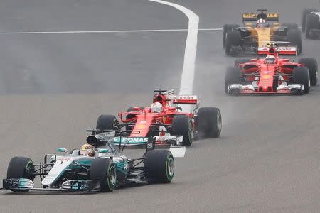 Formula One - F1 - Chinese Grand Prix - Shanghai, China - 09/04/17 - Mercedes driver Lewis Hamilton of Britain leads the race at the start of the Chinese Grand Prix at the Shanghai International Circuit. REUTERS/Aly Song