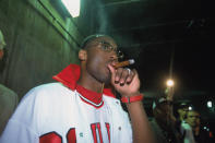 Kobe smokes a celebratory cigar after winning Game 4 of the 2002 NBA Finals, in a jersey other than his own — Michael Jordan’s Chicago Bulls No. 23 jersey. Respect. (Photo: Getty Images)