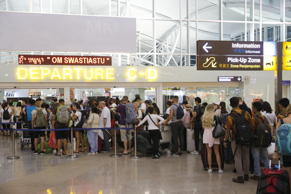 Long lines at airport in Bali as flights are cancelled or delayed. Source: AAP