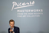 Oliver Barker, auctioneer and chairman of Sotheby's Europe, calls on a buyer during an auction of Pablo Picasso's master works at the Bellagio hotel and casino Saturday, Oct. 23, 2021, in Las Vegas. Sotheby's and the MGM Resorts Fine Art Collection hosted the auction, which raised $109 million from eleven pieces. (AP Photo/Ellen Schmidt)