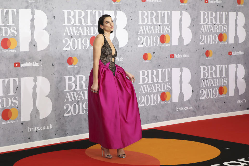 Singer Dua Lipa poses for photographers upon arrival at the Brit Awards in London, Wednesday, Feb. 20, 2019. (Photo by Vianney Le Caer/Invision/AP)