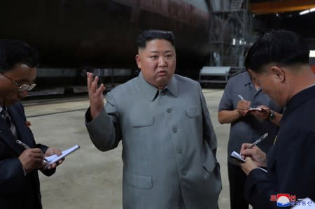 North Korean leader Kim Jong Un visits a submarine factory in an undisclosed location, North Korea