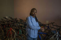 In this Friday May 1, 2020 photo, 34-year-old entrepreneur Fino Dlamini poses for a photograph inside her office in the Soweto township outside Johannesburg, South Africa. Business was good in January and February, and projections for the rest of 2020 were excellent. Then the coronavirus brought everything to an abrupt halt. Dlamini was confined to her small home under a strict lockdown, with few options for earning money. South Africa is struggling to balance its fight against the coronavirus with its dire need to resume economic activity. The country with the Africa’s most developed economy also has its highest number of infections — more than 19,000. (AP Photo/Bram Janssen)