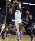 Dallas Mavericks' Delon Wright, center, shoots between Golden State Warriors' Alec Burks, left, and Willie Cauley-Stein (2) in the first half of an NBA basketball game Tuesday, Jan. 14, 2020, in San Francisco. (AP Photo/Ben Margot)