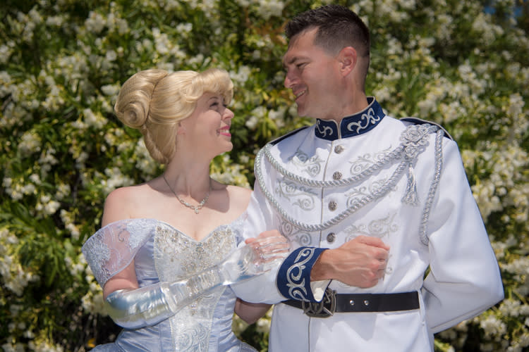 Mandy Pursley, in her hand-sewn Cinderella costume and glass arm, with her husband, Ryan Pursley, as Prince Charming. (Photo: Kelly Anderson)