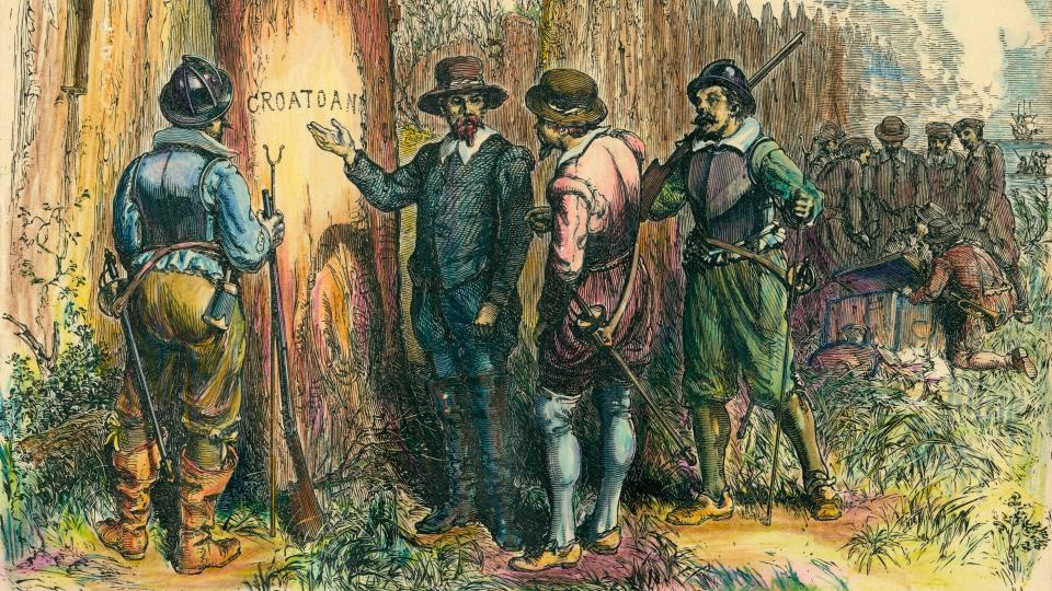 An illustration of John White and three men with guns pointing at a tree with the word CROATOAN carved into it.