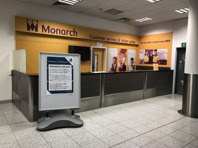 An empty Monarch customer services desk at Gatwick Airport
