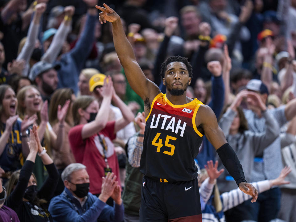 FILE - Utah Jazz guard Donovan Mitchell (45) reacts after hitting a 3-point shot against the Boston Celtics in the final minute of an NBA basketball game Friday, Dec. 3, 2021, in Salt Lake City. Cleveland made its acquisition of All-Star guard Donovan Mitchell in a trade with Utah official on Saturday, Sept. 3, 202, and now the Cavs can start figuring out ways to best integrate his talents into their young core of rising players. (AP Photo/Rick Egan, File)