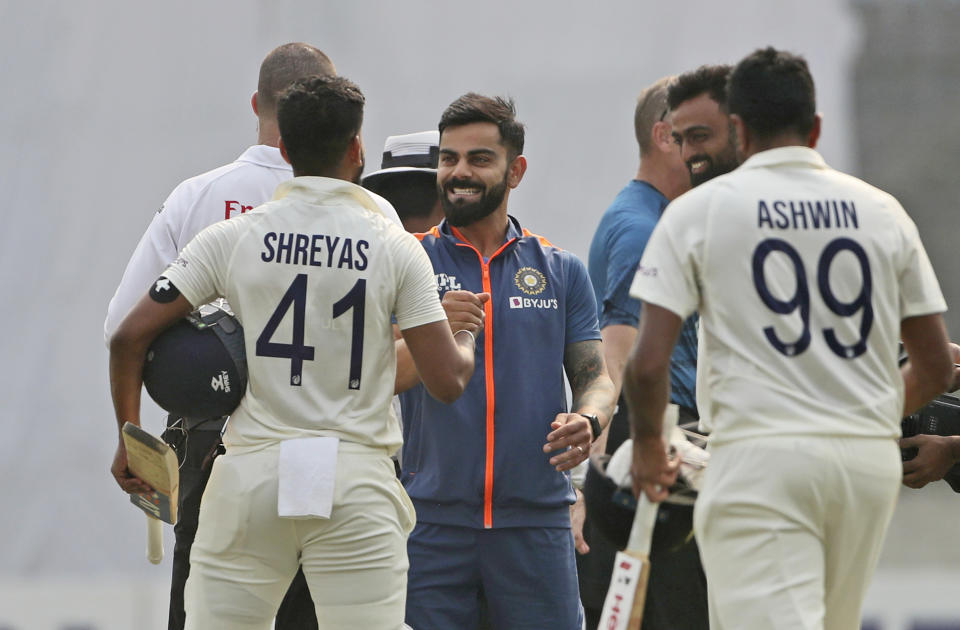 India's Ravichandran Ashwin, Shreyas Iyer and Virat Kohli celebrate their victory over Bangladesh during the second cricket test match in Dhaka, Bangladesh, Sunday, Dec. 25, 2022. (AP Photo/Surjeet Yadav)