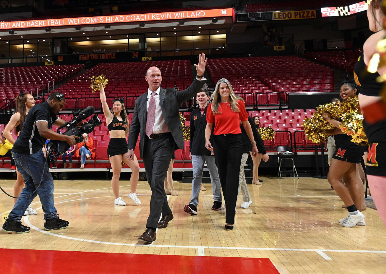 New Maryland head coach Kevin Willard walks to his introductory news conference alongside his wife, Julie, on March 22, 2022, at Xfinity Center in College Park, Maryland. (Kenneth K. Lam/Baltimore Sun/Tribune News Service via Getty Images)