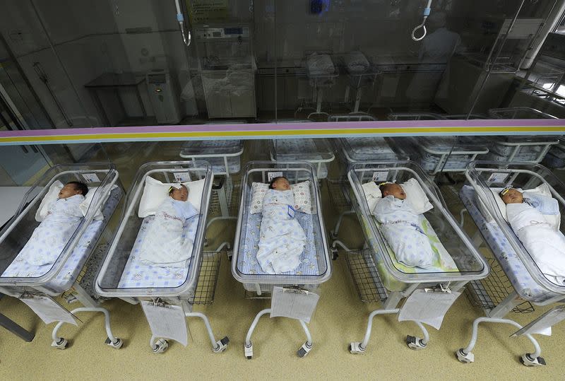 FILE PHOTO: Newborn babies sleep in a ward at a hospital in Hefei