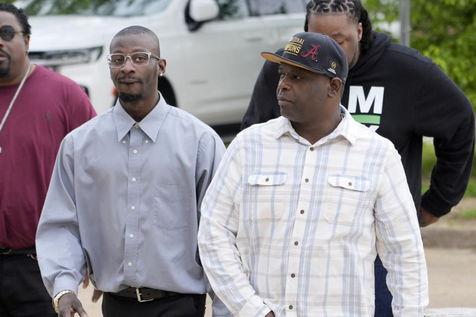 Michael Corey Jenkins, left, and Eddie Terrell Parker walk toward the Thad Cochran United States Courthouse in Jackson, Miss., Thursday, March 21, 2024, for sentencing on the fifth of the six former Mississippi Rankin County law enforcement officers who committed numerous acts of racially motivated, violent torture on them in 2023. The six former law officers pleaded guilty to a number of federal charges for torturing them and their sentencing began Tuesday in federal court. (AP Photo/Rogelio V. Solis)