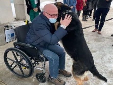 <p>Brian Myers with Sadie outside of the Englewood Health hospital in February 2021</p> ((Ramapo Bergen Animal Refuge))