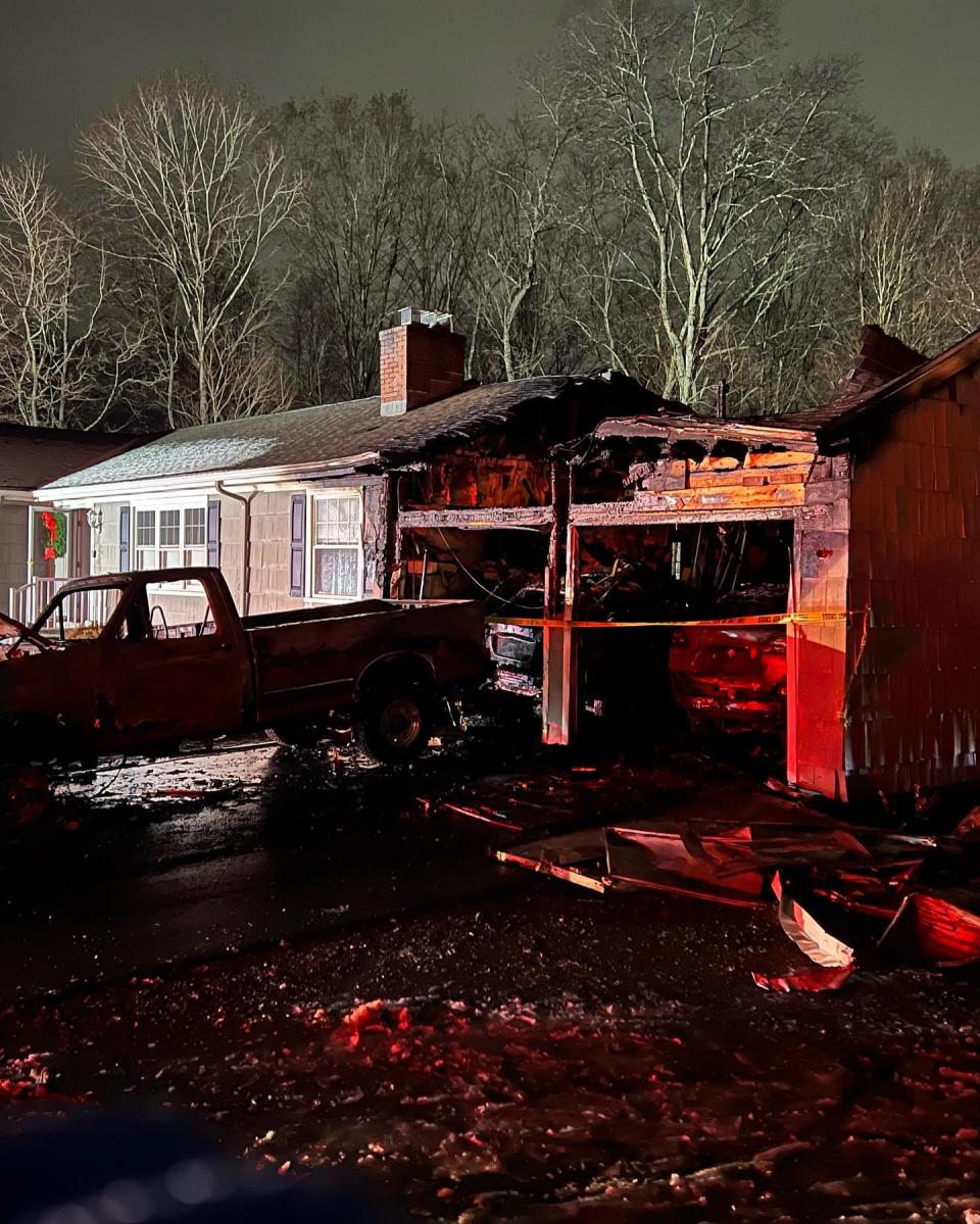 Damage from a house fire on Jan. 7, 2024 in Trumbull, Connecticut is shown. A volunteer firefighter with the Long Hill Volunteer Fire Company was out plowing roads when he spotted a fire in the garage and woke the four sleeping people inside.