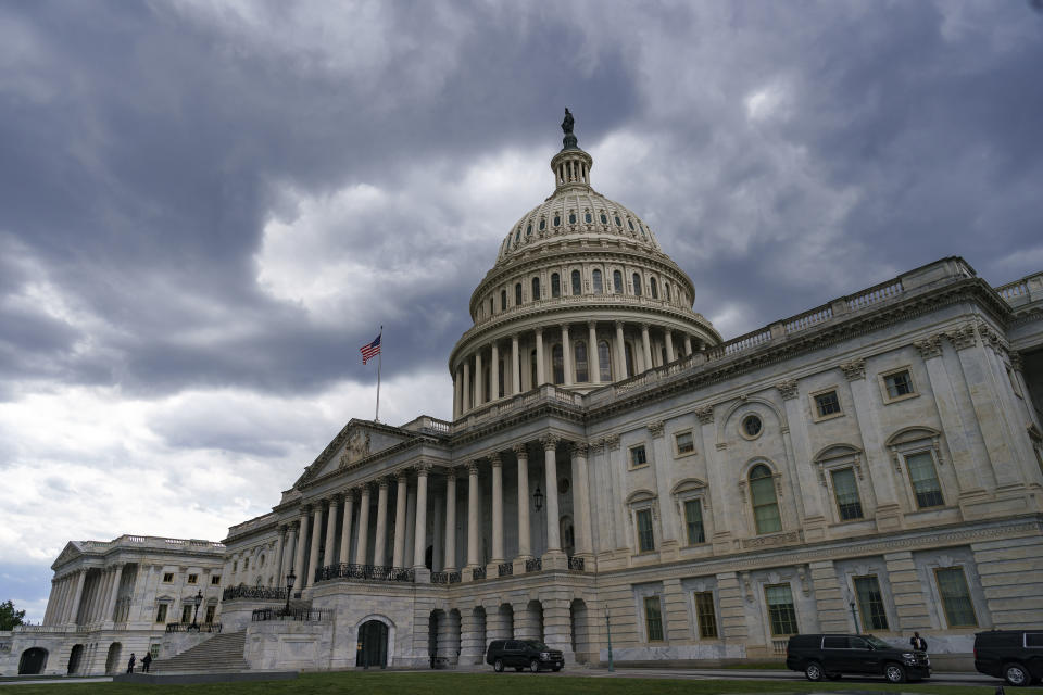 The Capitol is seen under dark skies in Washington, Tuesday, May 11, 2021. House Minority Leader Kevin McCarthy, R-Calif., has set a Wednesday vote for removing Rep. Liz Cheney, R-Wyo., from her No. 3 Republican leadership post after Cheney repeatedly challenged former President Donald Trump over his claims of widespread voting fraud and his role in encouraging supporters' Jan. 6 attack on the Capitol. (AP Photo/J. Scott Applewhite)