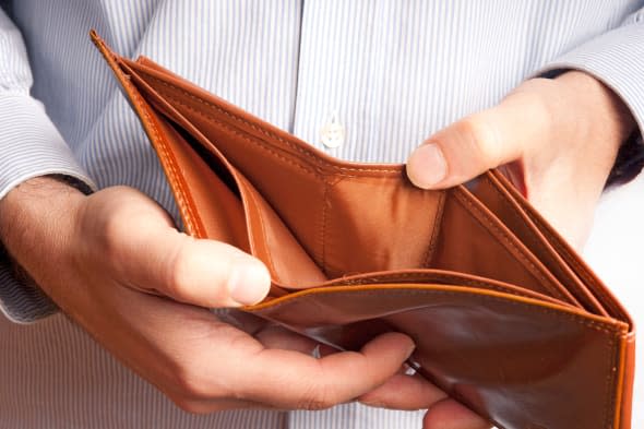 man showing an empty wallet