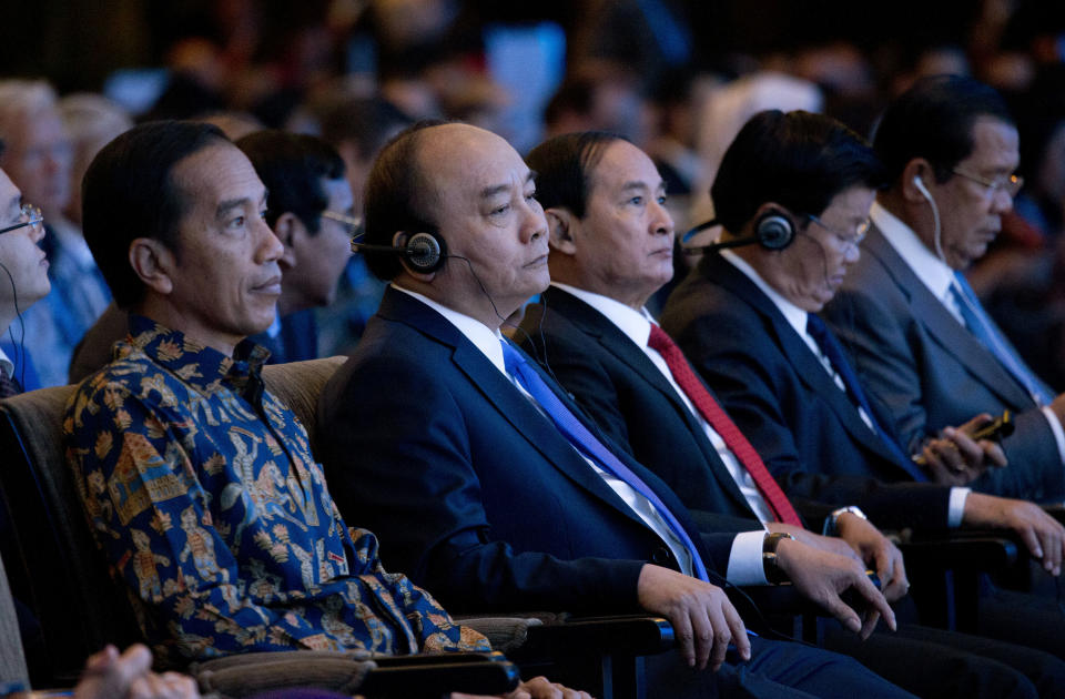 From left to right, Indonesia's President Joko Widod, Vietnam's Prime Minister Nguyen Xuan Phuc, Myanmar President Win Myint, Laos Prime Minister Thongloun Sisoulith and Cambodia's Prime Minister Hun Sen attend the opening of International Monetary Fund (IMF) World Bank annual meetings in Bali, Indonesia on Friday, Oct. 12, 2018. (AP Photo/Firdia Lisnawati)