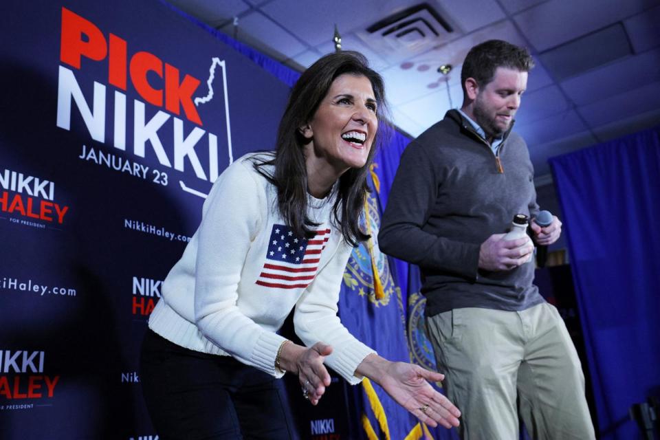 PHOTO: Republican presidential candidate Nikki Haley reacts as former Keene Mayor George Hansel presents her with a bottle of maple syrup for her birthday, at a campaign stop in Keene, N.H., on Jan. 20, 2024.  (Brian Snyder/Reuters)