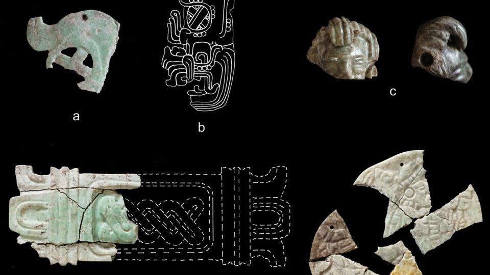 Burned and cracked greenstone ornaments are shown from the burial deposit: a) a Hu'unal diadem, b) a drawing of a Hu'unal diadem from the Topoxté site, c) a pendant of a human head, d) a plaque with mat design (drawing by D. Hounzell), and e) an incised decorated disc. - C. Halperin/Courtesy Antiquity