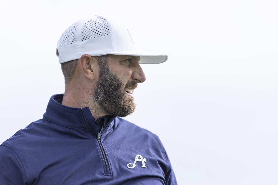 Captain Dustin Johnson of 4Aces GC looks on from the driving range before the first round of LIV Golf Chicago, Friday, Sept. 22, 2023, in Sugar Grove, Ill. (Katelyn Mulcahy/LIV Golf via AP)