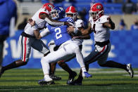 Georgia defensive back Richard LeCounte (2) tackles Kentucky quarterback Joey Gatewood (2) during the first half of an NCAA college football game, Oct. 31, 2020, in Lexington, Ky. (AP Photo/Bryan Woolston)