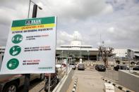 FILE PHOTO: A FAAN (Federal Airports Authority of Nigeria) sign with the coronavirus disease (COVID-19) protective measures is seen at the domestic wing of the Nnamdi Azikiwe International airport in Abuja