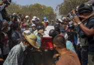 People carry the coffin of Kyal Sin for burial in Mandalay, Myanmar, Thursday, March 4, 2021. Kyal Sin was shot in the head by Myanmar security forces during an anti-coup protest rally she was attending Wednesday. (AP Photo)