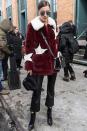 <p>In a star-patterned Guess fur jacket, black pants, Giuseppe Zanotti boots, cross body bag and Vera Wang aviator sunglasses at NYFW. </p>