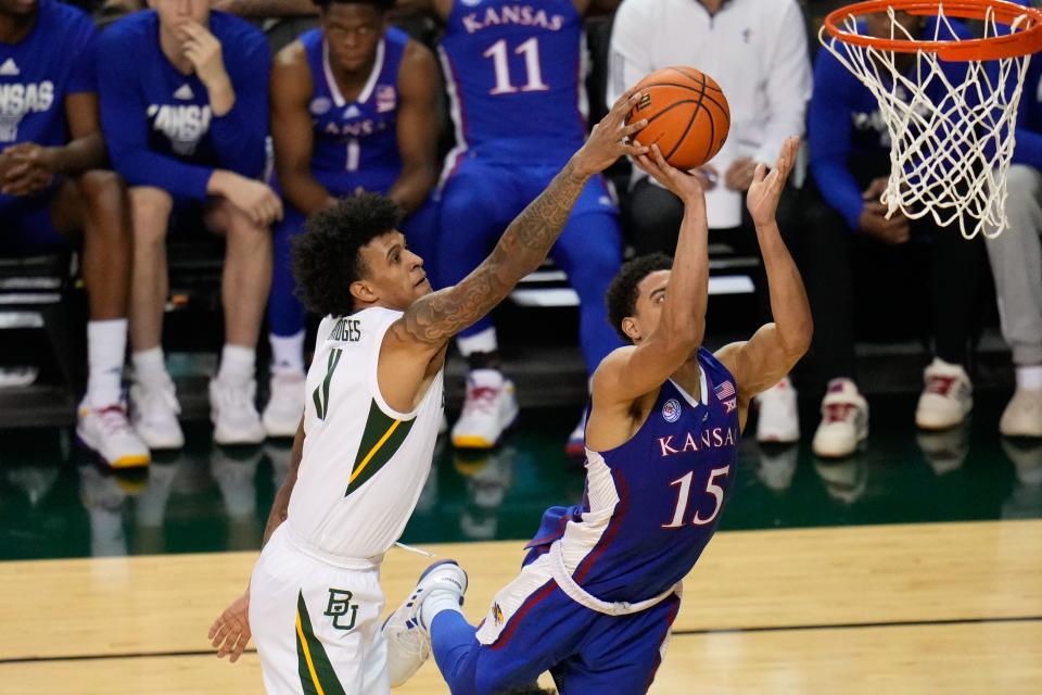 Kansas guard Kevin McCullar Jr. (15) has his shot blocked by Baylor forward Jalen Bridges (11) during the second half of their 2023 game at Ferrell Center.