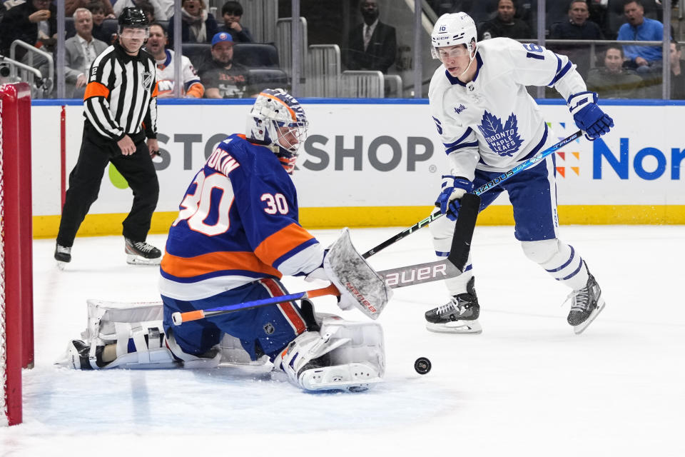 New York Islanders goaltender Ilya Sorokin (30) stops a shot on goal by Toronto Maple Leafs' Mitchell Marner (16) during the first period of an NHL hockey game Tuesday, March 21, 2023, in Elmont, N.Y. (AP Photo/Frank Franklin II)