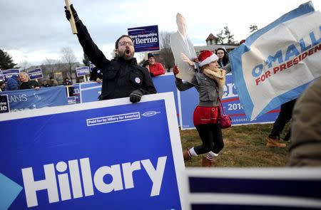 Supporters of U.S. Democratic presidential candidates Bernie Sanders, Hillary Clinton and Martin O'Malley rally before the Democratic presidential candidates debate at Saint Anselm College in Manchester, New Hampshire, December 19, 2015. REUTERS/Gretchen Ertl