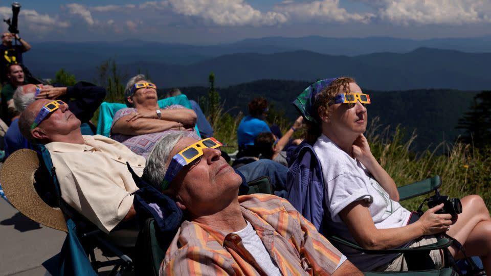 People watch as the solar eclipse approaches totality from Great Smoky Mountains National Park, Tennessee, on August 21, 2017. - Jonathan Ernst/Reuters