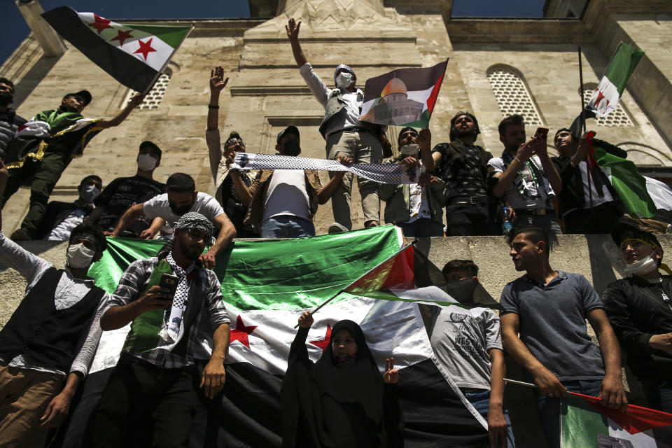 Protesters chant anti-Israel slogans during a rally outside Fatih mosque in Istanbul following Friday prayers, Friday, May 4, 2021, in support of Palestinians, killed in the recent escalation of violence in Jerusalem and the Gaza Strip. People in Turkey have been demonstrating against Israel this week and have gathered without much interference from the police despite a strict lockdown to curb COVID-19 infections that have ordered people to stay home until May 17.(AP Photo/Emrah Gurel)