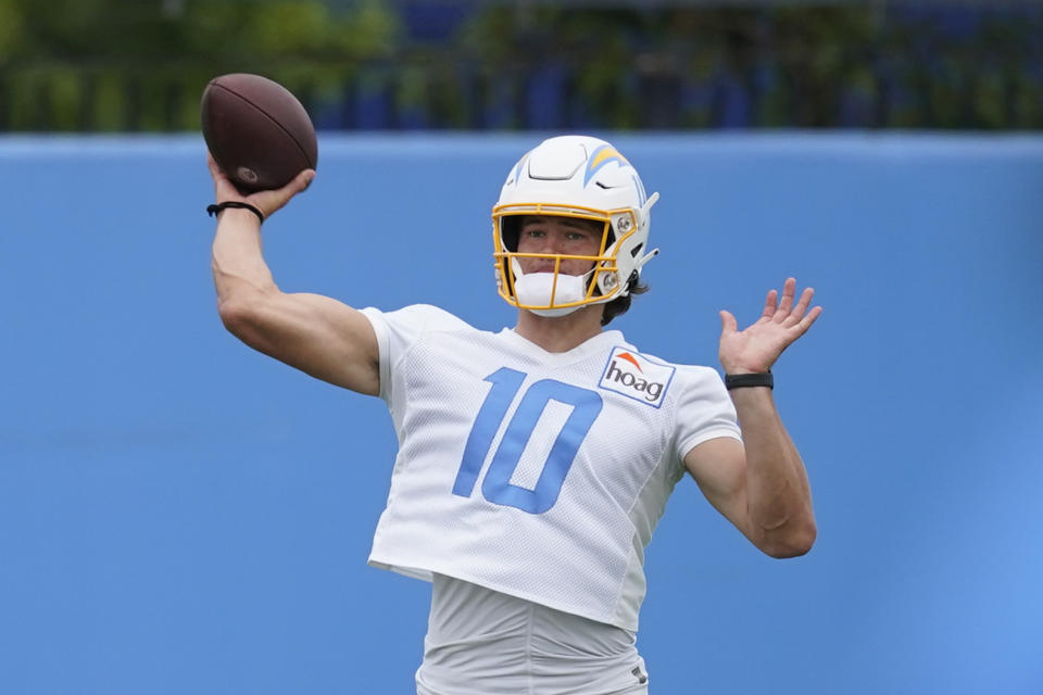 Los Angeles Chargers quarterback Justin Herbert participates in drills during an NFL football practice at the Chargers practice facility in Costa Mesa, Calif., Monday, May 23, 2022. (AP Photo/Ashley Landis)