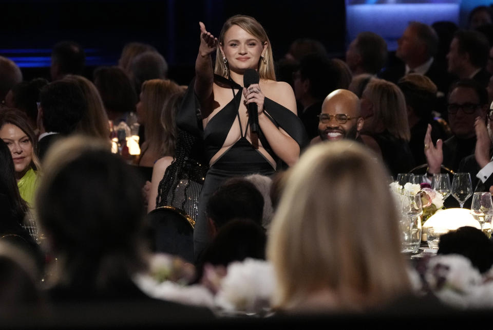Actor Joey King speaks about honoree Nicole Kidman, foreground right, during the 49th AFI Life Achievement Award tribute to Kidman, Saturday, April 27, 2024, at the Dolby Theatre in Los Angeles. (AP Photo/Chris Pizzello)