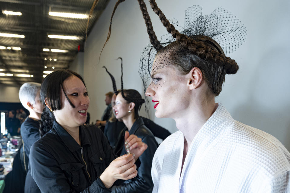 Models are prepped before the Thom Browne fall/winter 2024 fashion show during New York Fashion Week, Wednesday, Feb. 14, 2024, in New York. (AP Photo/Peter K. Afriyie)