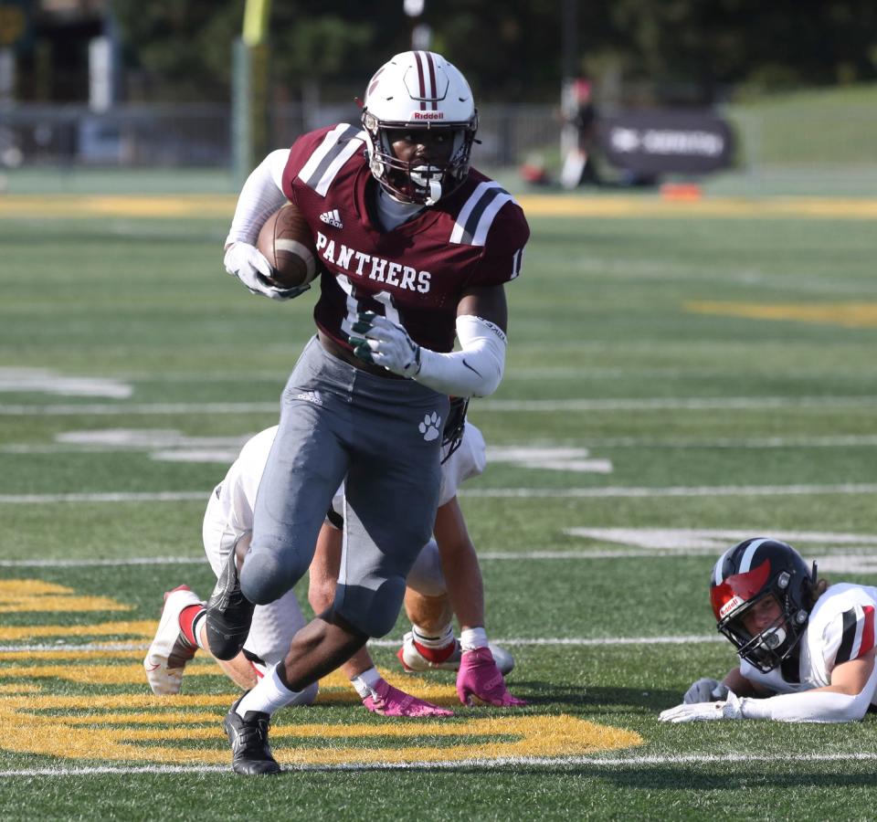 River Rouge receiver Nicholas Marsh makes a catch against Cedar Springs defensive back Ryan Mitchell during second-half action of the Xenith Prep Kickoff Classic at  Tom Adams Field at Wayne State on Saturday, Aug. 27, 2022.