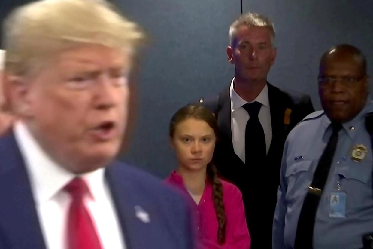Swedish environmental activist Greta Thunberg watches as Donald Trump enters the United Nations to speak with reporters: REUTERS