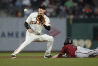 Arizona Diamondbacks' Geraldo Perdomo (2) steals second base as San Francisco Giants second baseman Wilmer Flores waits for the throw duringp the fifth inning of a baseball game in San Francisco, Wednesday, Aug. 17, 2022. (AP Photo/Godofredo A. Vásquez)