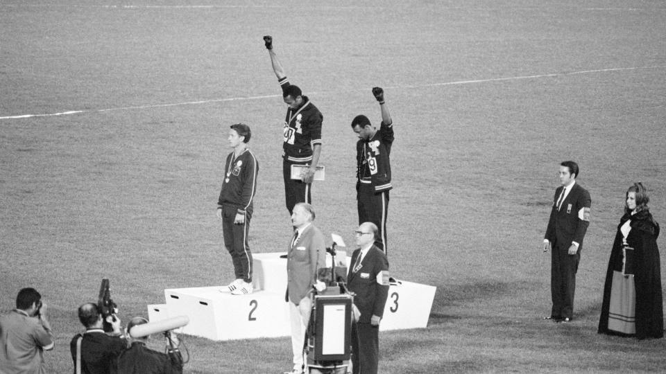 Tommie Smith (center), John Carlos (right) and Australian Peter Norman (left). (Bettmann Archives/Getty Images)
